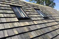 Clement slate profile rooflights within a shingle roof.