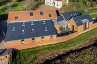 This 250 year old listed barn has been given a new lease of life with over twenty new Clement Conservation Rooflights.