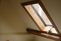 Clement conservation rooflight in bathroom with brass hand winder