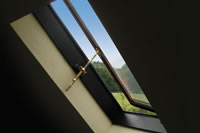 Internal view of Clement side hung rooflight with brass hand winder