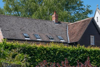 Clement Conservation Rooflights look in keeping with the character of the traditional building they are installed into, here you can see them laid flush in a tile roof.